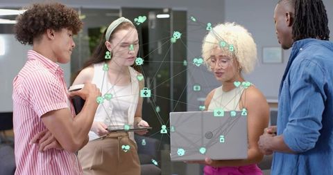 Collaborating around laptop with augmented reality network overlay in modern office lounge