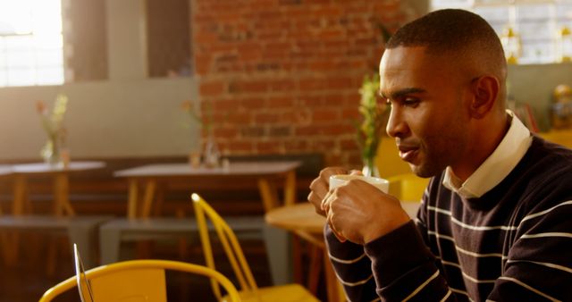 Man Enjoying Coffee at Cozy Modern Cafe - Download Free Stock Images Pikwizard.com