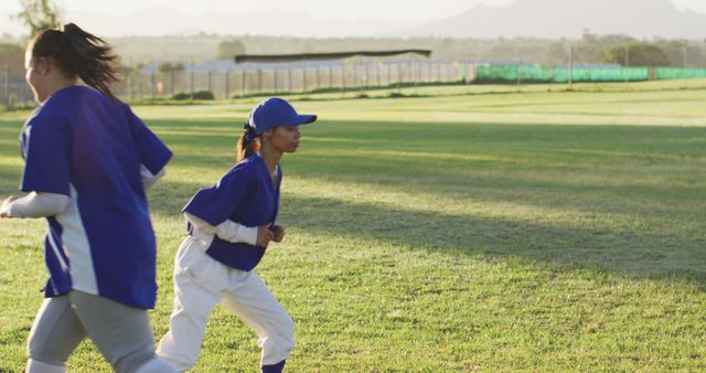 Teenage Female Softball Players Jogging in Park - Download Free Stock Images Pikwizard.com