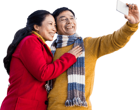 Happy older asian couple taking selfie on cold day, transparent background
