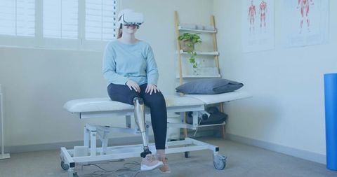 Woman with Prosthetic Limb Using VR for Rehabilitation Therapy