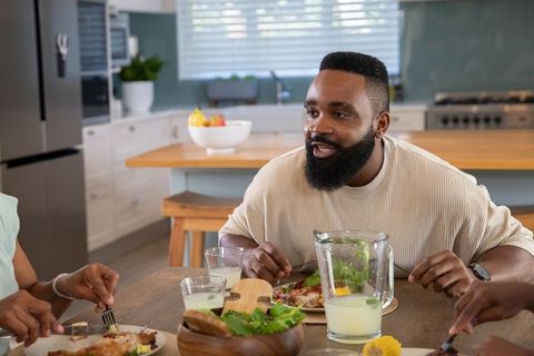 Family Enjoying Meal in Modern Kitchen