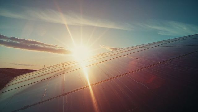 Sunrise Reflections on Solar Panels