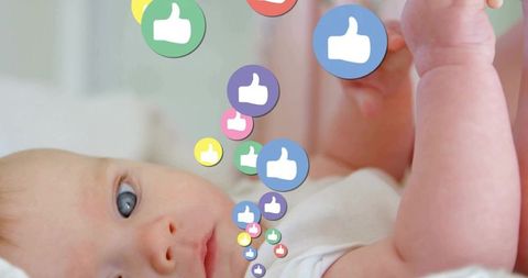 Baby discovering world with floating colorful icons