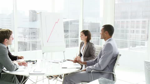 Diverse Team Analyzing Business Growth in Modern Office