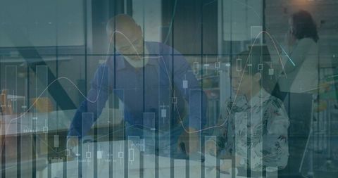 Business team analyzing charts and planning in modern office