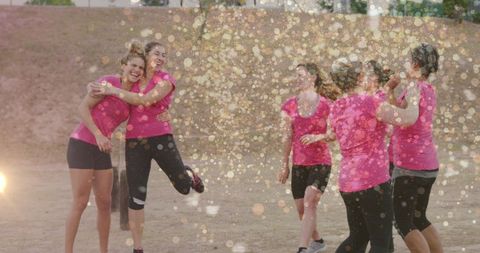 Joyful Women Celebrating at Outdoor Fitness Event