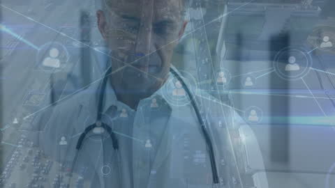 Senior Doctor Interacting with Digital Network in Healthcare Setting