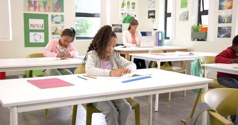 Diverse Children Engaged in Classroom Artistic Activities