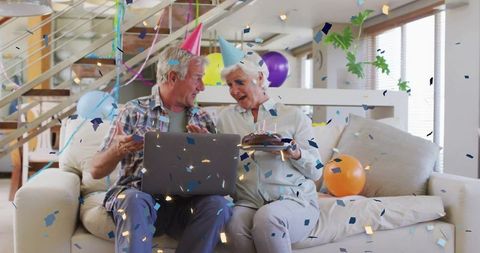 Senior couple celebrating virtual birthday at home
