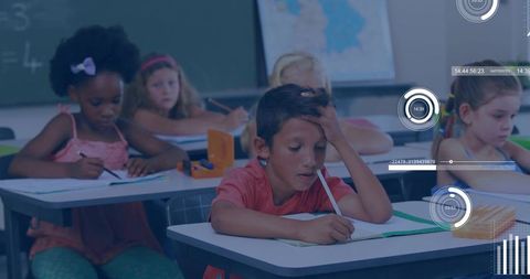 Young Diverse Classroom Studying with Focus and Concentration