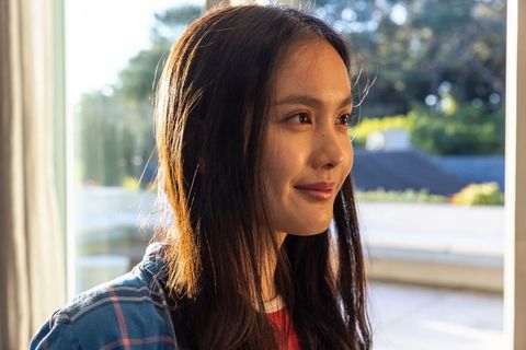 Relaxed Woman in Sunlit Home Environment