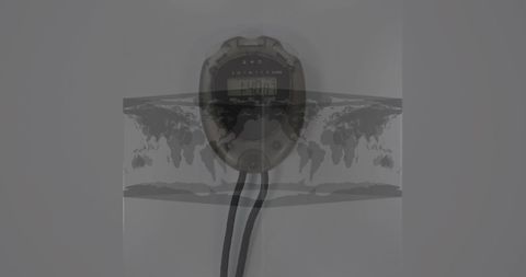 Stopwatch overlaps world map symbolizing global sports challenges