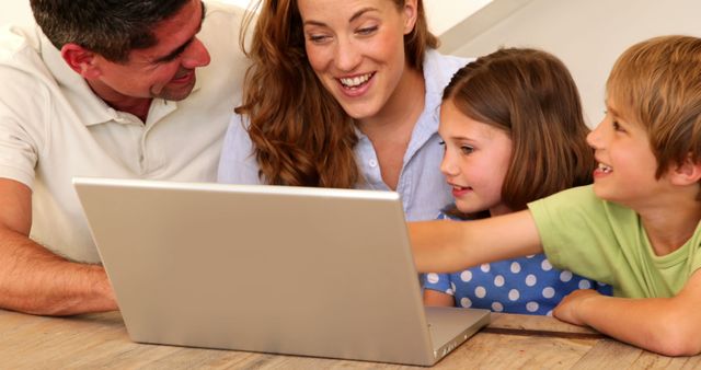 Happy Family Watching Content on Laptop - Download Free Stock Images Pikwizard.com