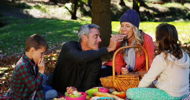 Happy Family Having Picnic Outdoors in Park - Download Free Stock Images Pikwizard.com