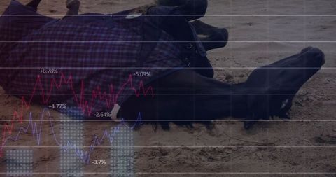 Man lying on sand layered with financial chart graphic