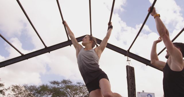 Man and Woman Exercising on Outdoor Monkey Bars - Download Free Stock Images Pikwizard.com