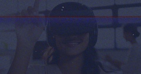 Woman Using VR Headset with Digital Interference Overlay