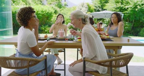 Bridal Shower Celebration with Friends and Cupcakes Outdoors