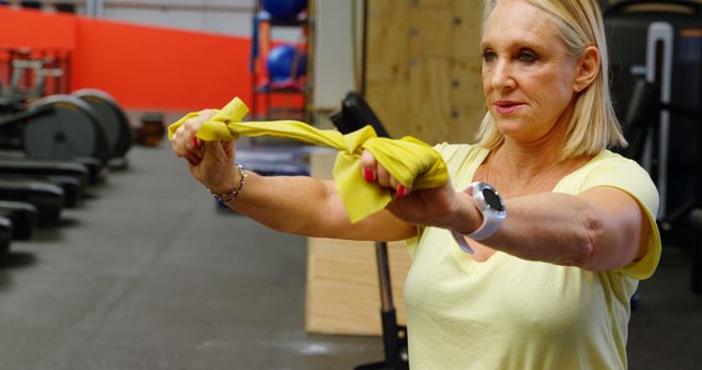 Senior Woman Exercising in Gym with Resistance Band - Download Free Stock Images Pikwizard.com