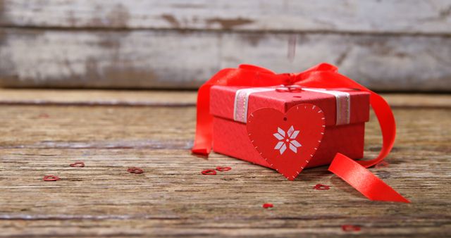 Red Gift Box with Heart Decoration on Rustic Wooden Surface - Download Free Stock Images Pikwizard.com