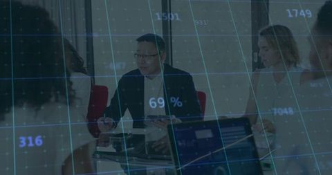 Businessman Analyzing Data with Team in Modern Office Environment