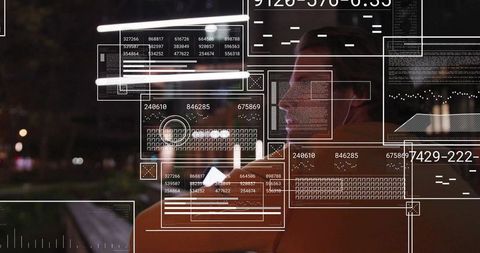 Commuter viewing augmented reality data on night bus