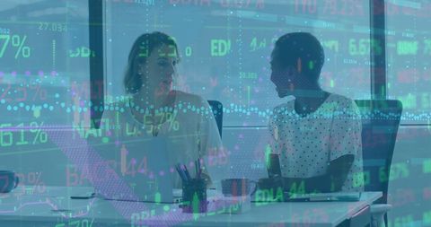 women collaborating in modern office with financial overlay - Download Free Stock Images Pikwizard.com