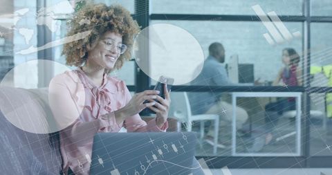 Happy Businesswoman Analyzing Financial Data on Smartphone in Office - Download Free Stock Images Pikwizard.com