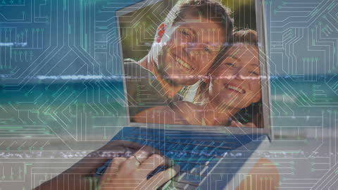 Smiling Man and Woman on Laptop with Circuit Overlay