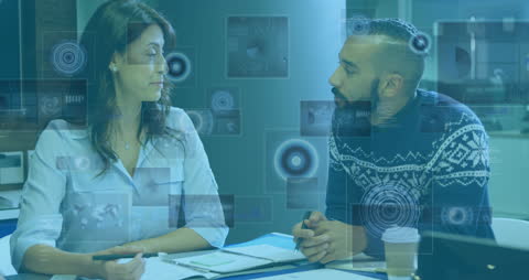 Diverse Team Analyzing Digital Data Amidst Holographic Graphics