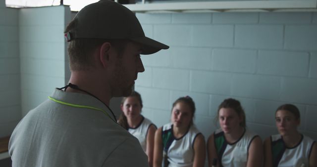 Coach Giving Speech to Young Female Basketball Team in Locker Room - Download Free Stock Images Pikwizard.com