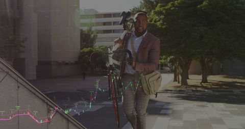 Businessman with road bicycle walking up stairs