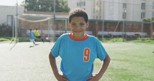 Smiling Young Soccer Player on Outdoor Field - Download Free Stock Images Pikwizard.com