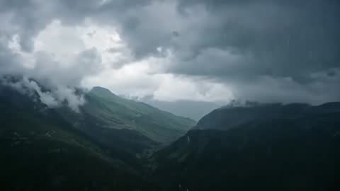 Stormy Mountain Valley with Mist and Raindrops