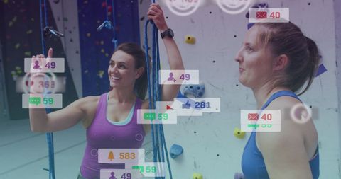 Women Engaging with Fitness Technology in Climbing Gym