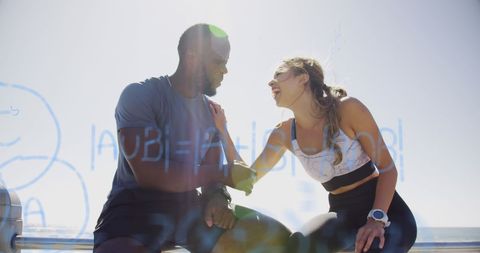 Coach Discussing Training Strategies with Athlete in Fitness Session