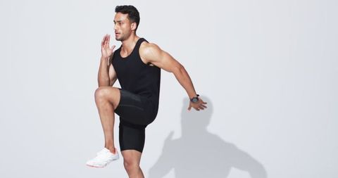 Athletic man running in place exhibiting energy and fitness