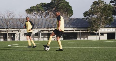 Soccer Players Practicing Ball Control on Sunny Day
