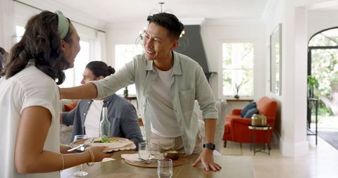 Friends Preparing for Wedding Celebration at Home with Smiles and Teamwork