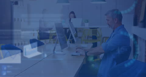 Businessman Analyzing Stock Market Data on Office Computer