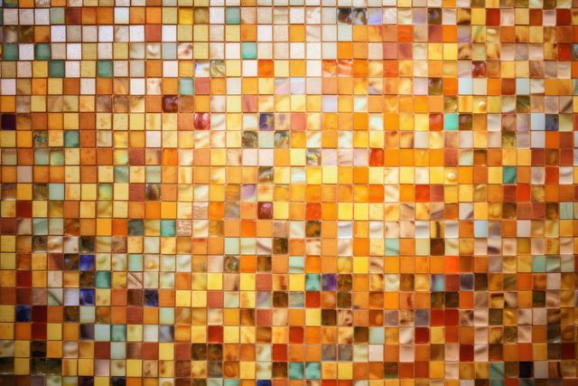 Bright abstract mosaic tile wall with a mix of colorful squares creating a vibrant pattern. Ideal for use in design projects, backgrounds, wallpapers, or texturing in interior design visuals and architectural themes.