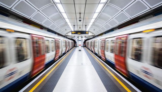 Symmetrical metro station with motion blur trains conveying speed and modern urban transit