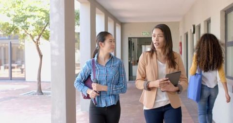 Asian Teenager and Mentor Discuss Academic Goals on School Campus - Download Free Stock Images Pikwizard.com