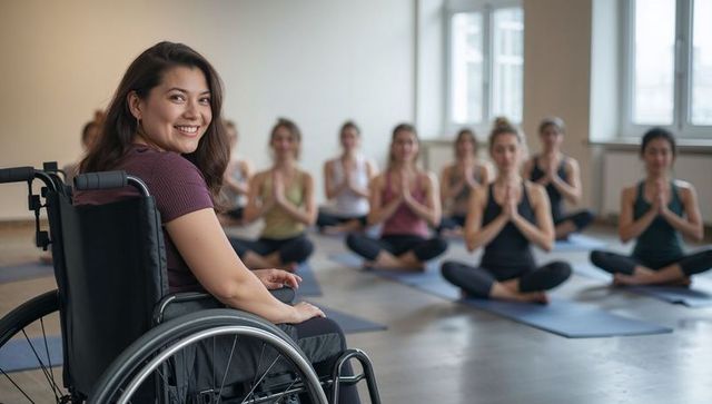 Smiling woman in wheelchair leading inclusive yoga class promoting adaptive mindfulness