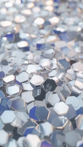 Vertical Macro Video Showing Shifting Focus Across Hexagonal Metallic Flakes Scattering Light