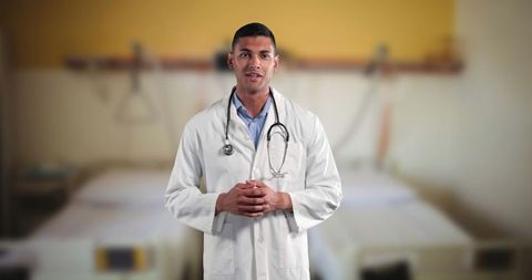 Confident Doctor with Stethoscope in Hospital Room