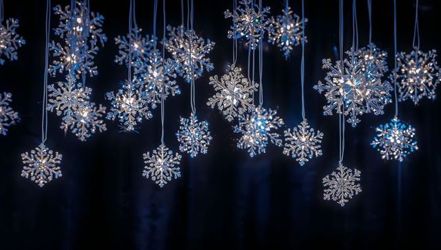 Crystal snowflake ornaments hanging with cool-white blue led glow for winter holiday decor