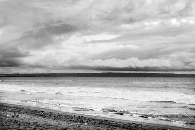 Dramatic Cloudy Sky Over Calm Seashore in Black and White - Download Free Stock Photos Pikwizard.com