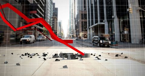 Financial crisis concept with crashing graph and cityscape background